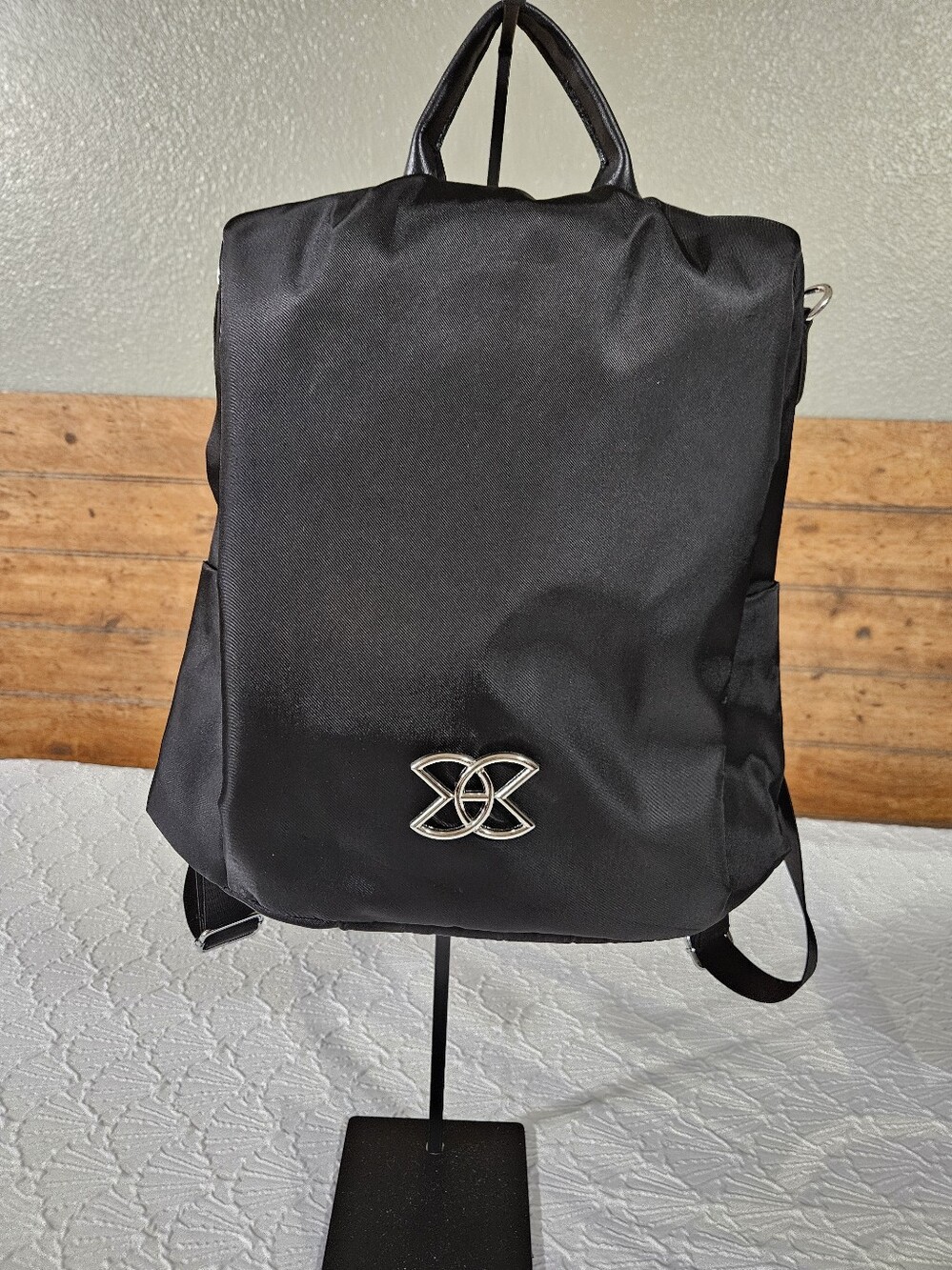 Amazon Women's Black Nylon Anti-theft Backpack with Silver Emblem